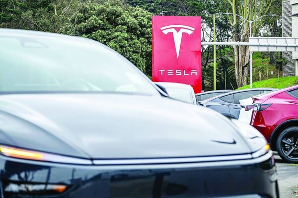 Tesla produced 50,000 more cars than it sold